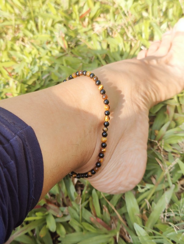 Black tourmaline and tiger eye anklet for protection.